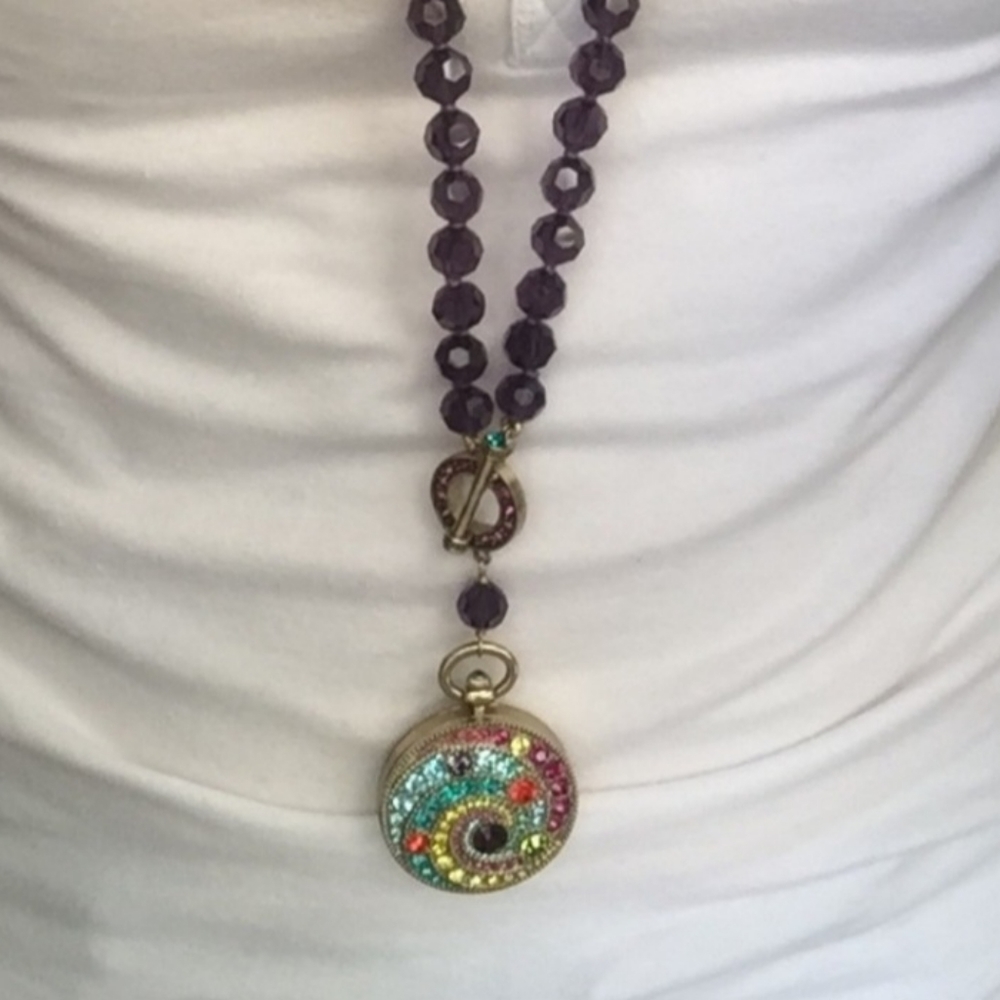 Timing is Everything. Heidi Daus Alice Through the Looking Glass pendant watch.